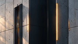 Concrete facade with a glowing vertical light