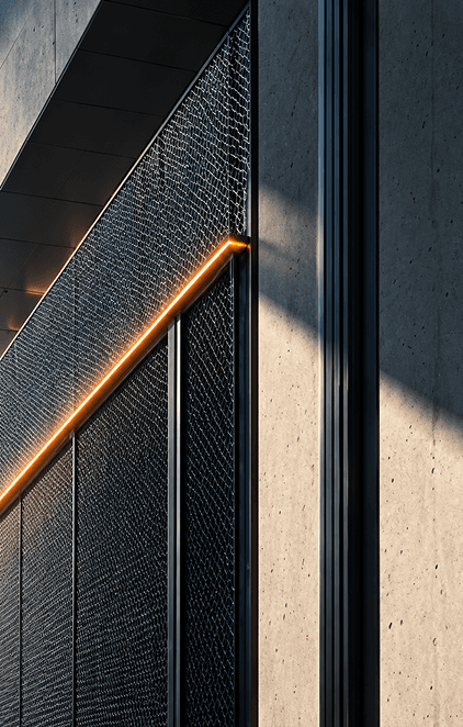 Concrete facade with a dark metal mesh panel and a glowing amber light line
