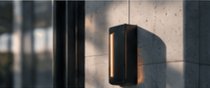 Wall-mounted light fixture on a concrete facade