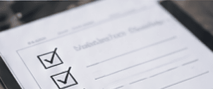 Checklist on a clipboard with ticked boxes